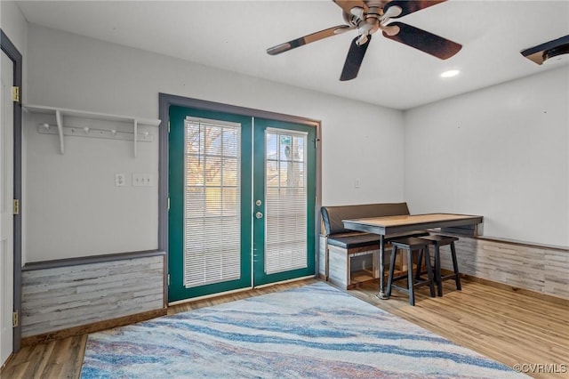 dining room featuring french doors, wood finished floors, and recessed lighting