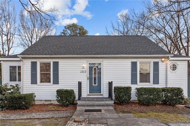 view of front of property with crawl space and roof with shingles