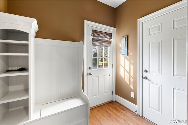 mudroom featuring baseboards and light wood-style floors