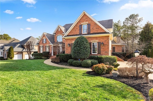 traditional home with a front lawn and brick siding