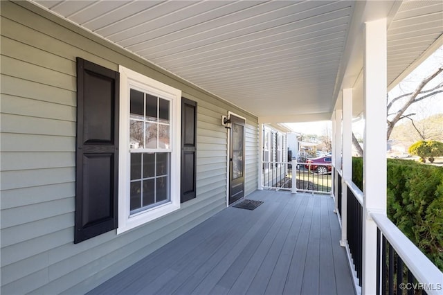 wooden terrace featuring a porch