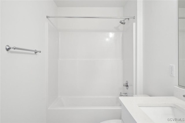 bathroom featuring toilet, washtub / shower combination, and vanity