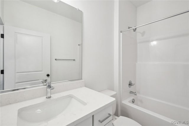 bathroom with shower / washtub combination, vanity, and toilet