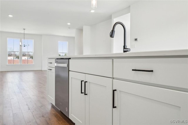 kitchen with pendant lighting, dark wood-style flooring, recessed lighting, light countertops, and white cabinets