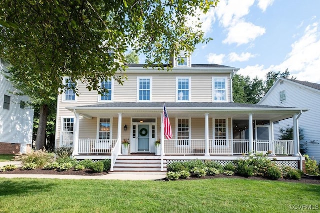 view of front of property with a porch and a front yard