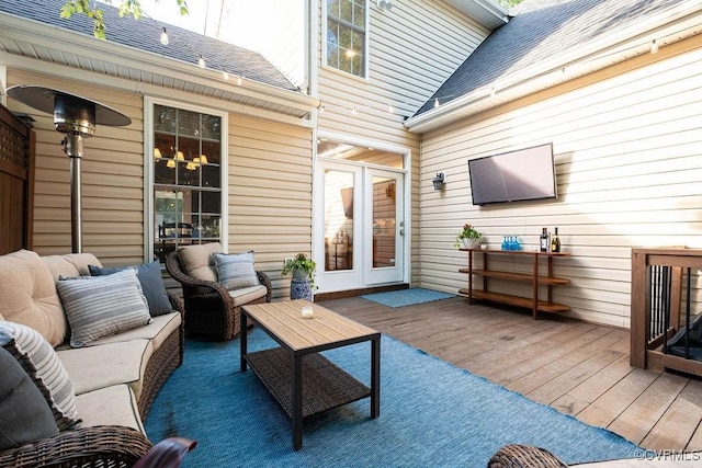 wooden terrace featuring an outdoor hangout area