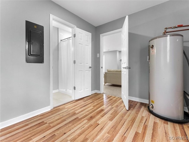 interior space with gas water heater and electric panel