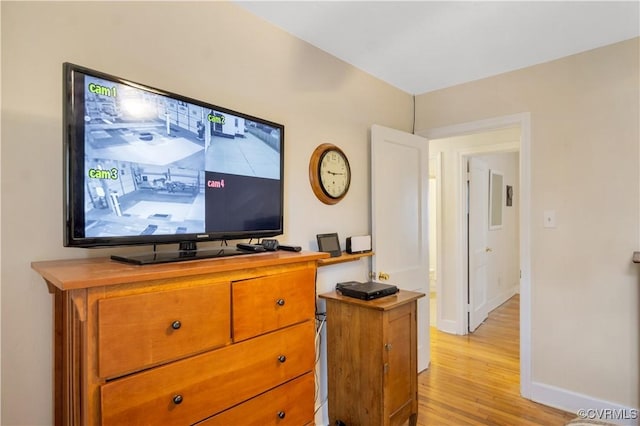 interior space with light wood-style floors and baseboards