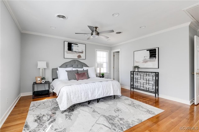 bedroom featuring attic access, visible vents, and wood finished floors