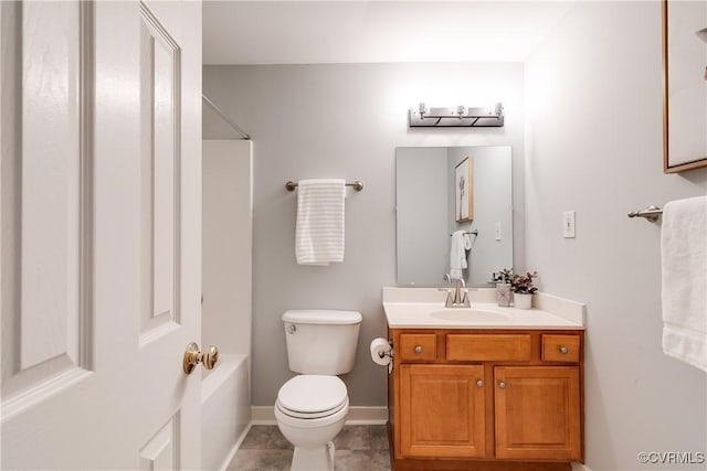 bathroom featuring toilet, vanity, baseboards, tile patterned floors, and washtub / shower combination