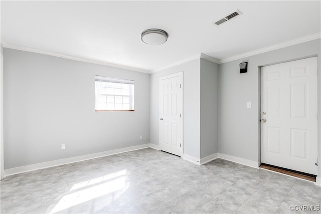 unfurnished bedroom with ornamental molding, visible vents, and baseboards