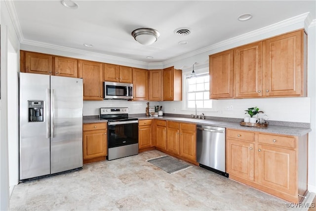 kitchen with stainless steel appliances, a sink, visible vents, light countertops, and crown molding