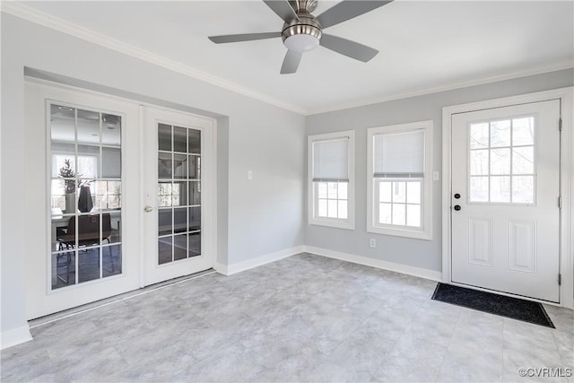 entryway featuring ornamental molding, french doors, a wealth of natural light, and baseboards