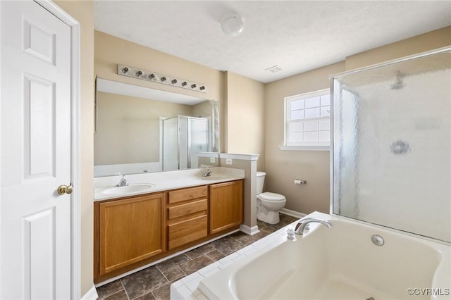 full bathroom featuring a garden tub, double vanity, toilet, a stall shower, and a sink