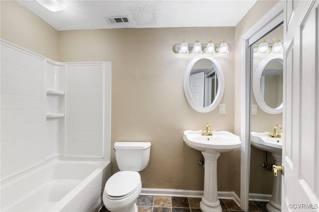 bathroom with shower / bath combination, visible vents, toilet, a textured ceiling, and baseboards