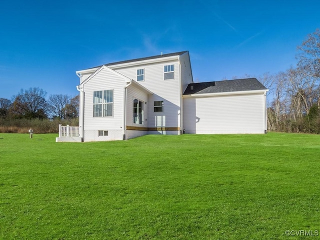 rear view of property with a yard