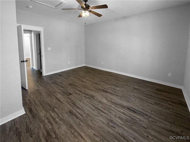 unfurnished room featuring ceiling fan, baseboards, and dark wood-type flooring