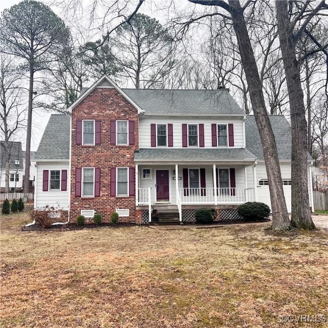 view of front of property featuring a porch, an attached garage, a shingled roof, brick siding, and crawl space