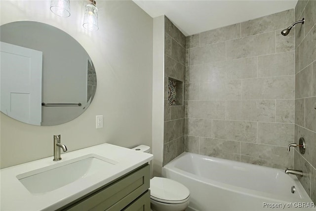 bathroom with toilet, tub / shower combination, and vanity