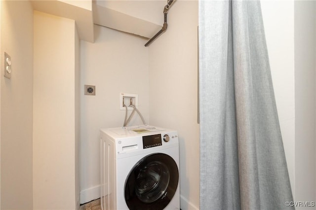 washroom with washer / dryer and laundry area