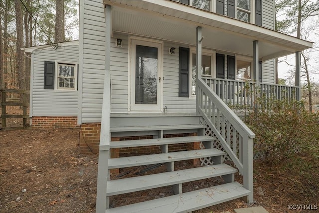 property entrance with covered porch