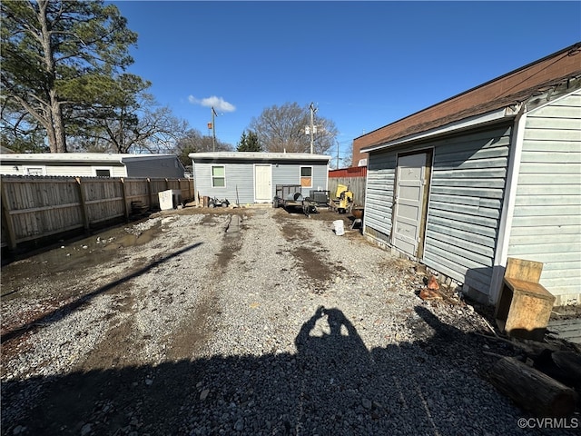 exterior space with fence and an outdoor structure