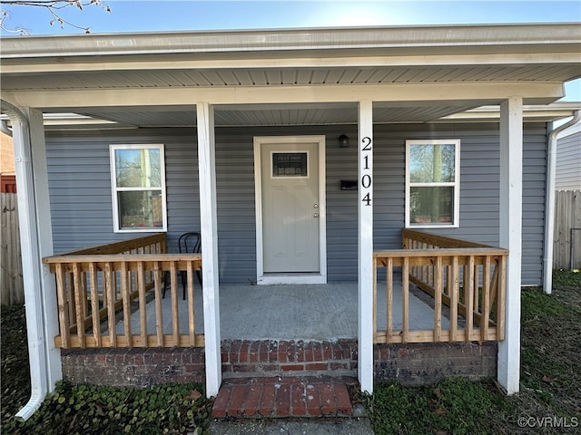 view of exterior entry featuring a porch