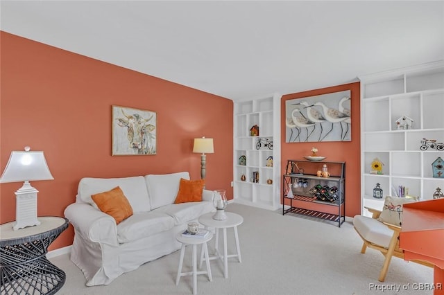 living room featuring carpet floors and built in features