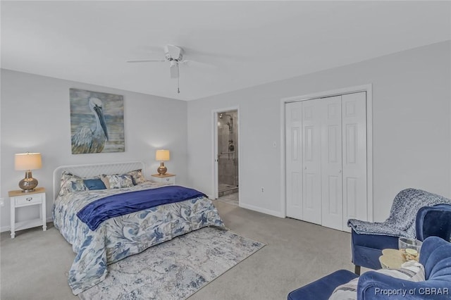 bedroom with ceiling fan, connected bathroom, light carpet, baseboards, and a closet