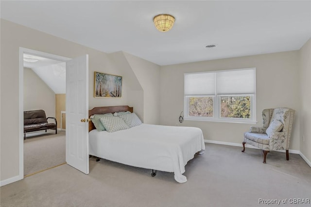 bedroom featuring baseboards, visible vents, and light colored carpet