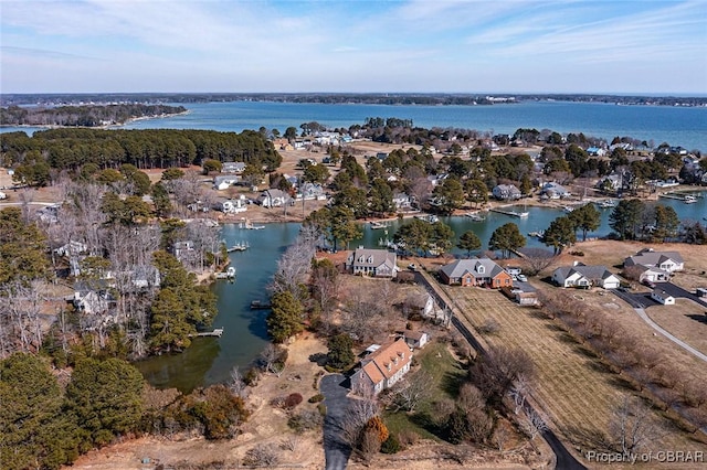 bird's eye view featuring a water view and a residential view