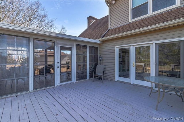 wooden terrace featuring a sunroom