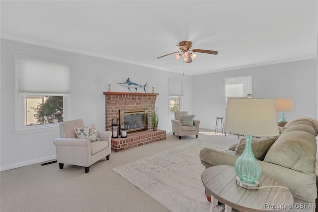 living area with crown molding, a brick fireplace, and light colored carpet