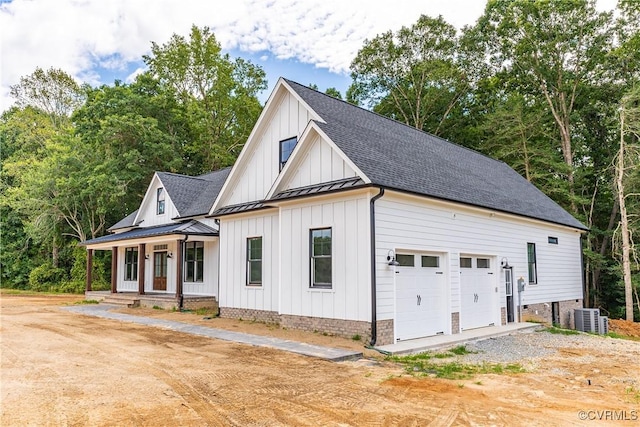 exterior space featuring driveway and central AC