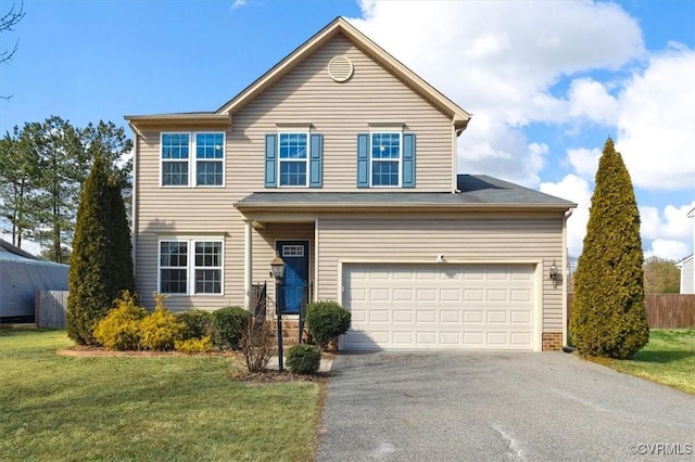 traditional-style home featuring a garage, a front lawn, fence, and aphalt driveway