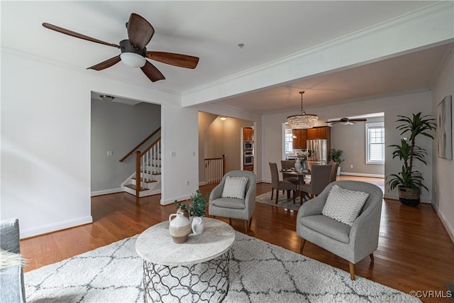 114 Cedar Works Row, Henrico, VA 23231 - living area featuring wood finished floors, stairway, baseboards, ceiling fan with notable chandelier, and ornamental molding