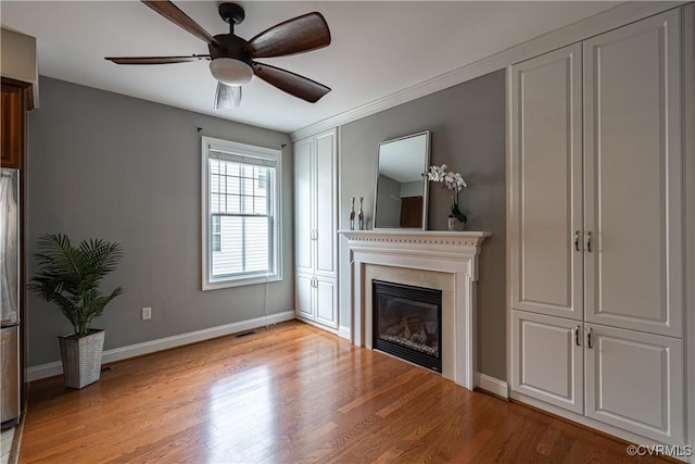 114 Cedar Works Row, Henrico, VA 23231 - unfurnished living room with a glass covered fireplace, baseboards, light wood finished floors, and visible vents