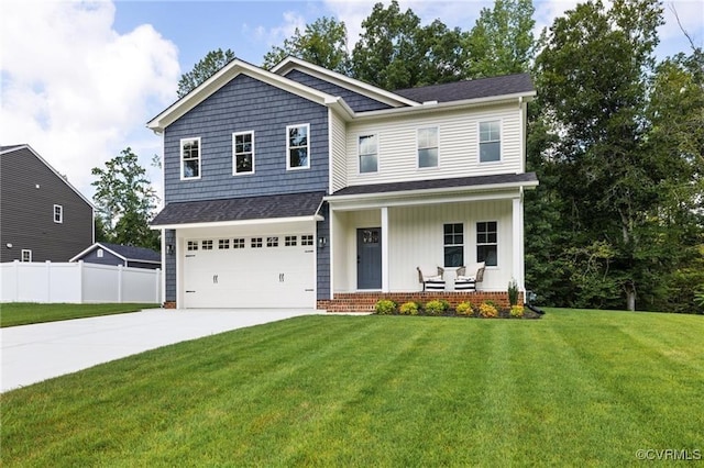 craftsman-style house featuring covered porch, fence, concrete driveway, and a front yard