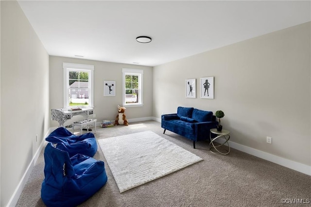 sitting room with carpet flooring and baseboards