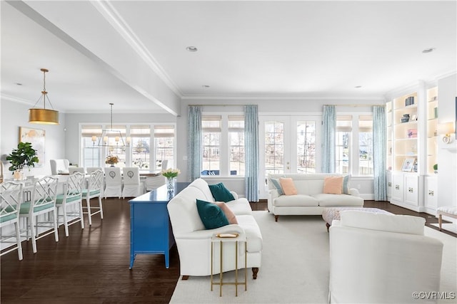 living area with ornamental molding, french doors, and dark wood finished floors