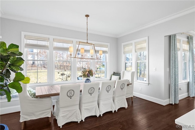 dining area with baseboards, a chandelier, dark wood-type flooring, and ornamental molding