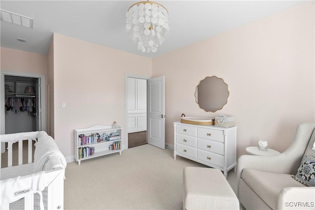 bedroom featuring a closet, visible vents, and light carpet