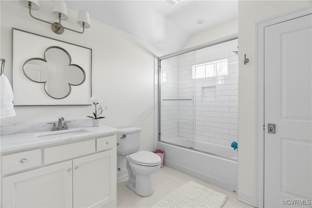 full bath with toilet, shower / bath combination with glass door, vanity, and tile patterned floors