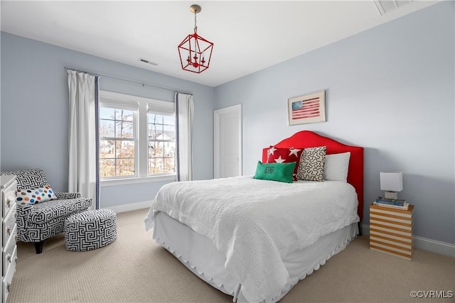 carpeted bedroom featuring visible vents and baseboards