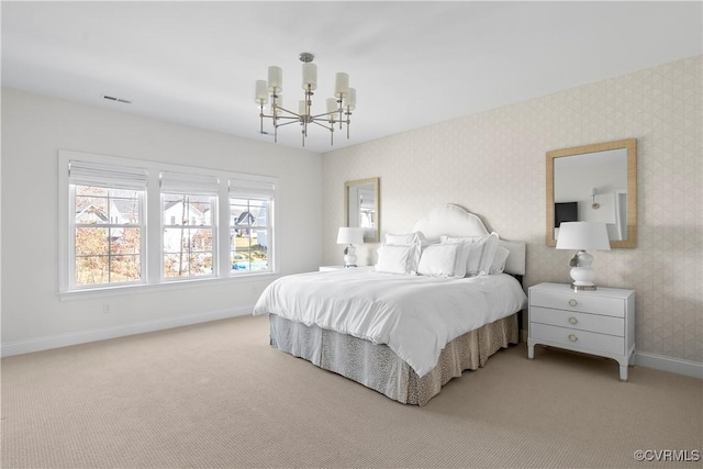 bedroom with light carpet, baseboards, a notable chandelier, and wallpapered walls