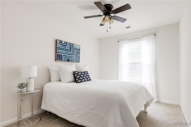 bedroom with carpet floors, a ceiling fan, visible vents, and baseboards