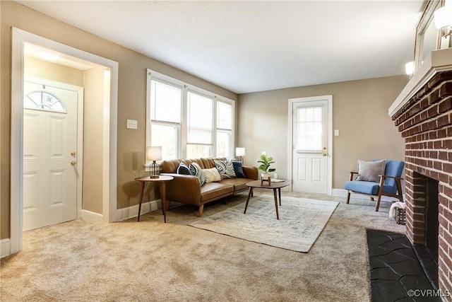 living area featuring a brick fireplace, light carpet, and baseboards