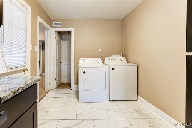 laundry room featuring marble finish floor, independent washer and dryer, visible vents, and baseboards