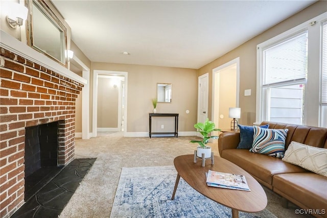 carpeted living room featuring a fireplace and baseboards