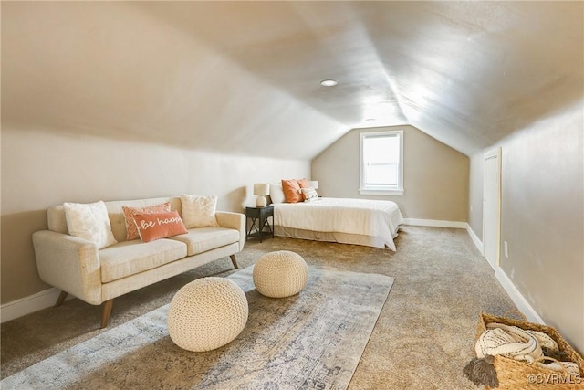 bedroom featuring carpet floors, lofted ceiling, and baseboards